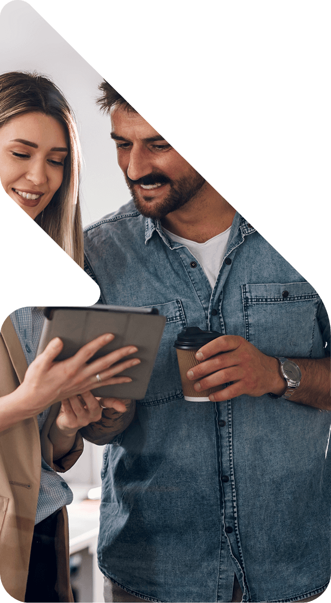 Image showing a man and a woman looking at a tablet