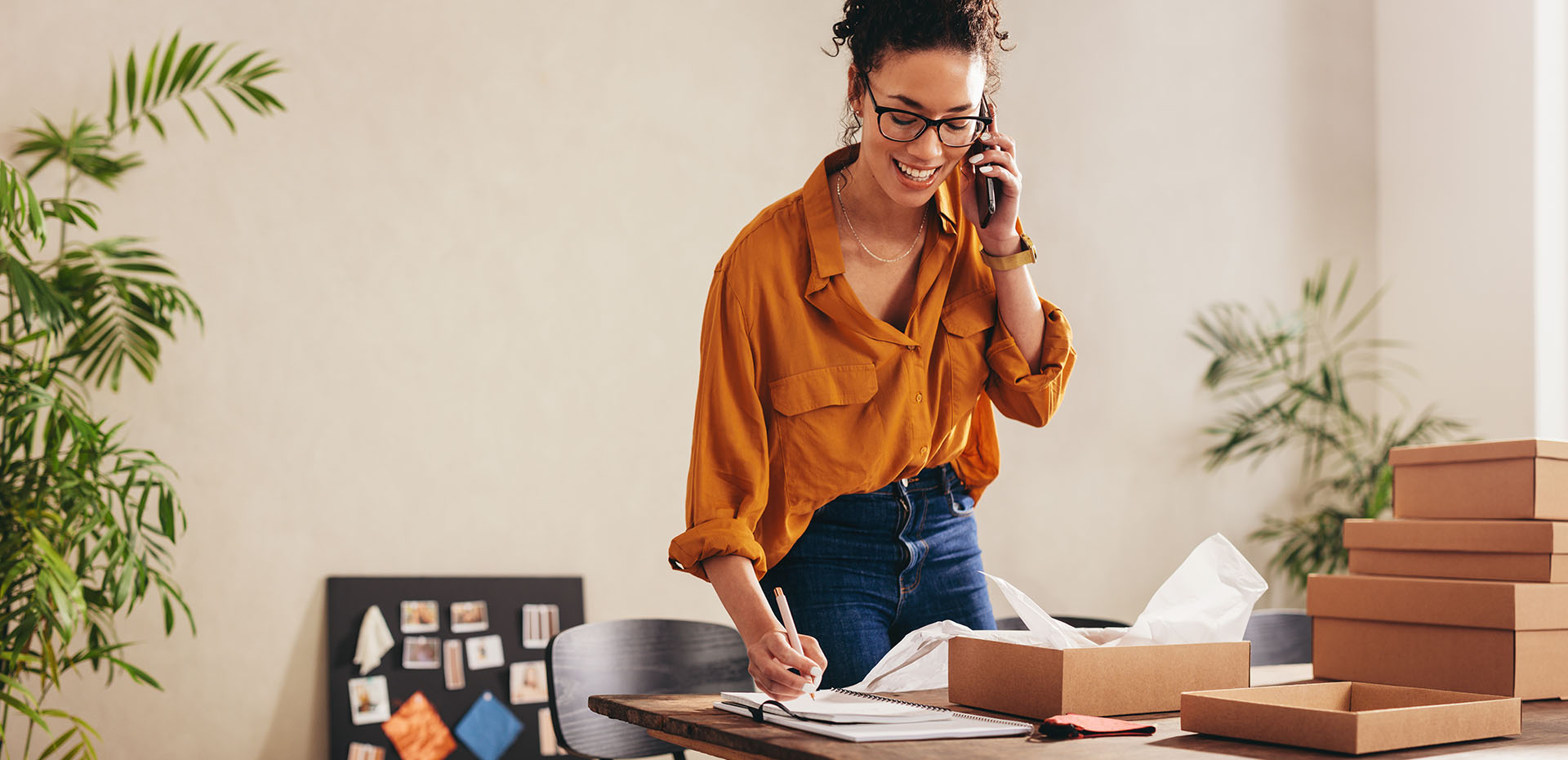Image showing a woman on the phone whilst looking at some paperwork