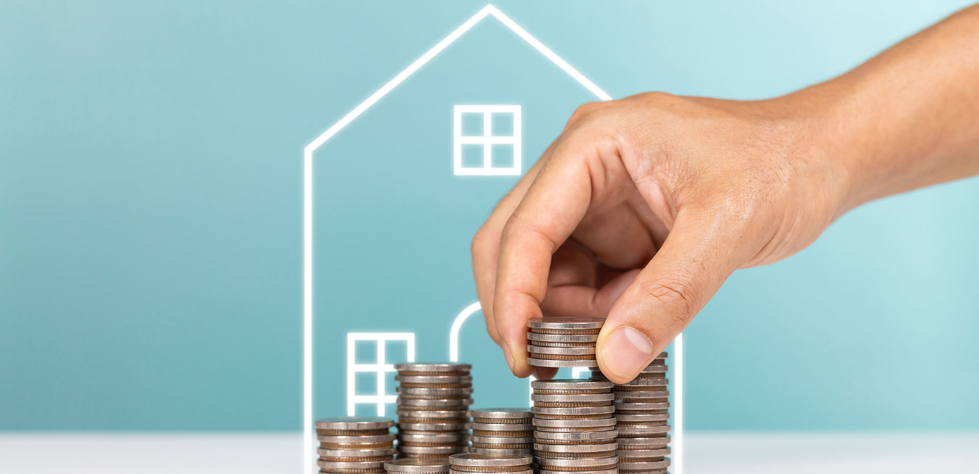 Image showing piles of coins in front of a drawing of a house