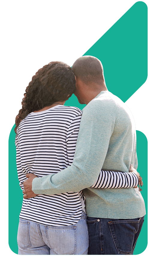 Image showing a couple facing away from the camera with arms round each other