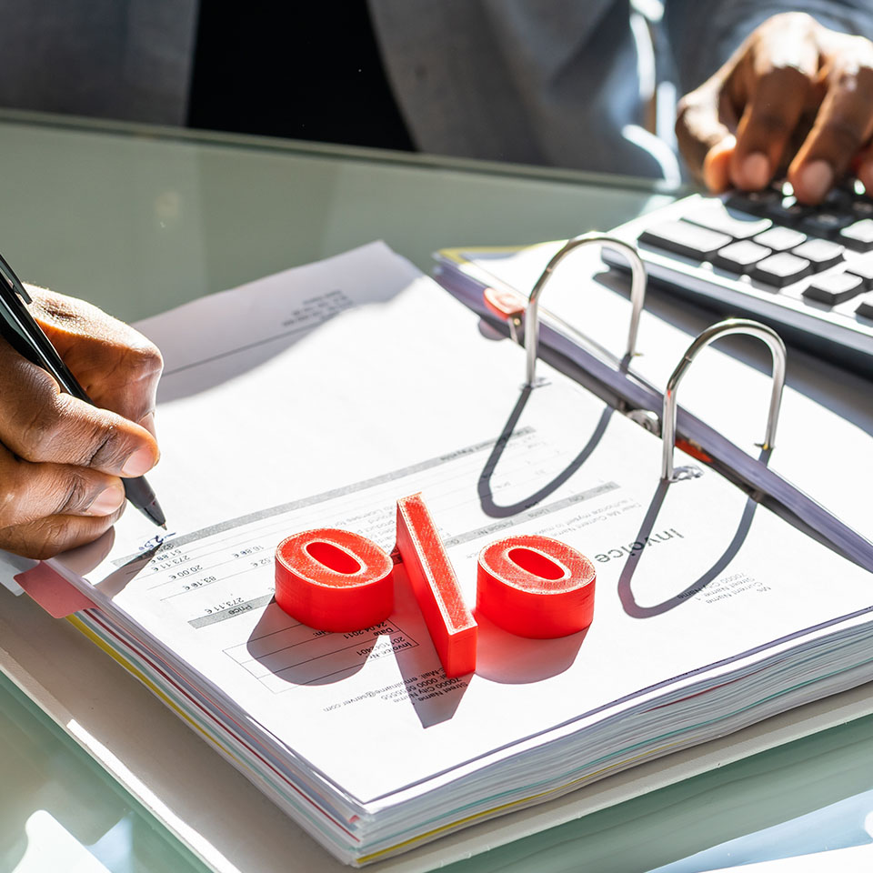Image showing a close up of a broker using a calculator