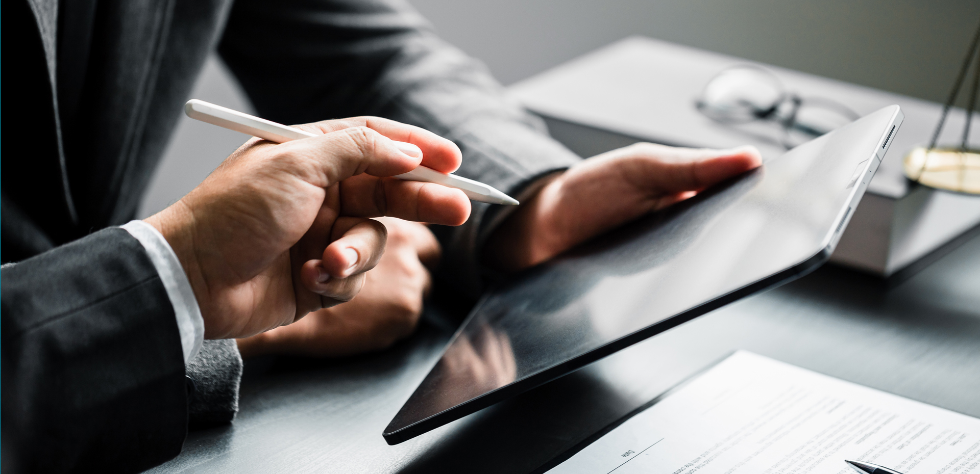 Image showing a person signing on a tablet